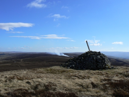 The currick on Killhope Law - note the heather burning in the background