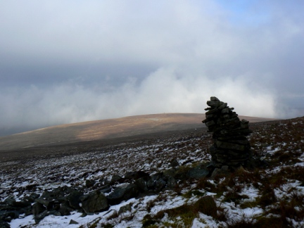 The leaning cairn below the summit looking towards Bruthwaite